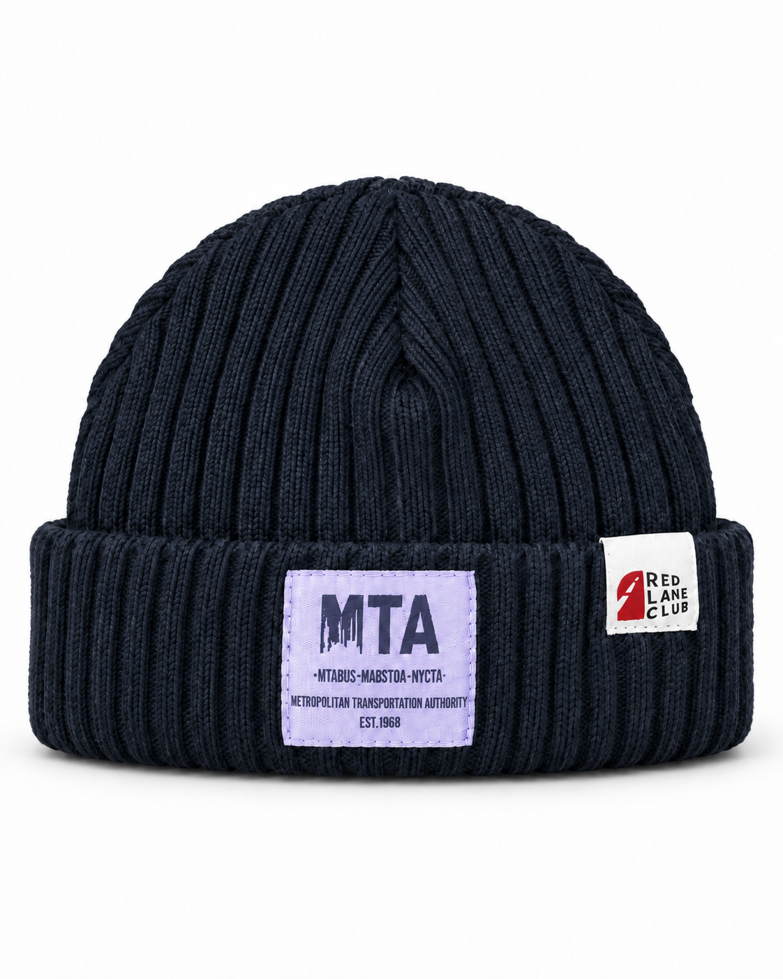 A dark navy blue ribbed knit beanie hat featuring a light purple rectangular patch on the front with 'MTA' and a white square patch on the side with 'Red Lane Club'.
